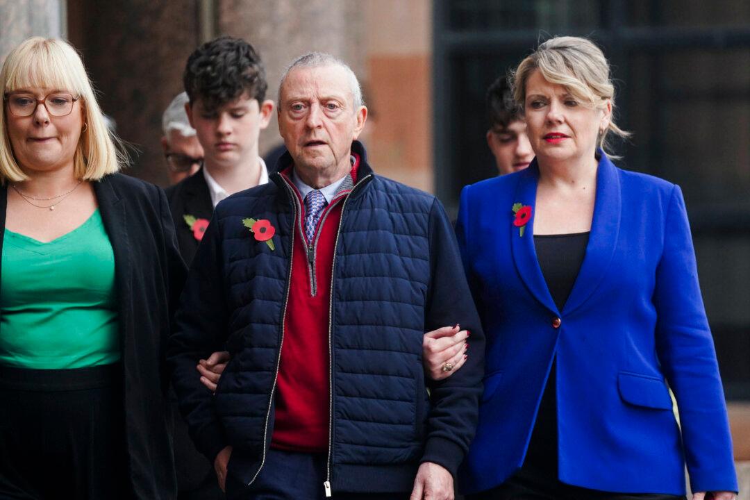 Patrick O'Hara (center) and family members leave Newcastle Crown Court, in Newcastle, England, on Nov. 6, 2024, where Dr. Thomas Kwan was sentenced to 31 years and five months after he attempted to murder Mr. O'Hara, who was his mother's partner, with a poisoned fake COVID jab whilst disguised as a nurse. (Owen Humphreys/PA via AP)