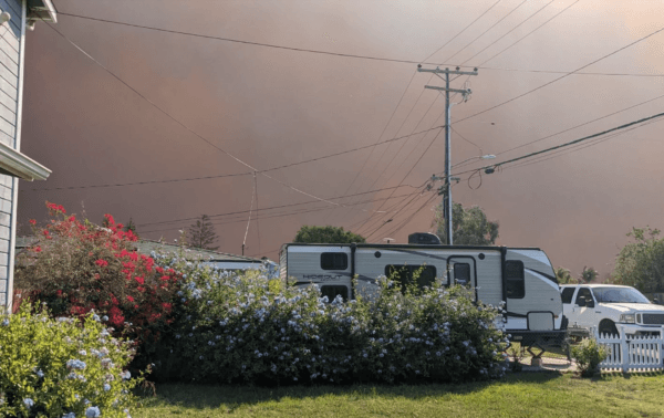 Smoke from the Mountain Fire darkens the sky over a neighborhood in Ventura County, Calif., on Nov. 6, 2024. (Monica Seeley/The Epoch Times)