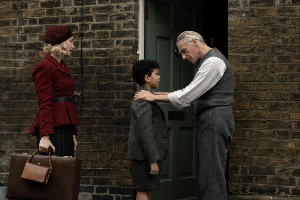 (L–R) Rita (Saoirse Ronan), her son George (Elliott Heffernan), and his grandfather Gerald (Paul Weller), in “Blitz.” (AppleTV+)