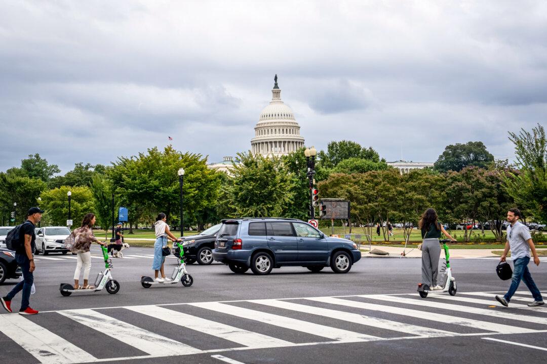 People cross a street near the U.S. Capitol on Sept. 16, 2024. Much of the tax cutting that Trump pledged during his reelection campaign will require cooperation from Congress. (Madalina Vasiliu/The Epoch Times)