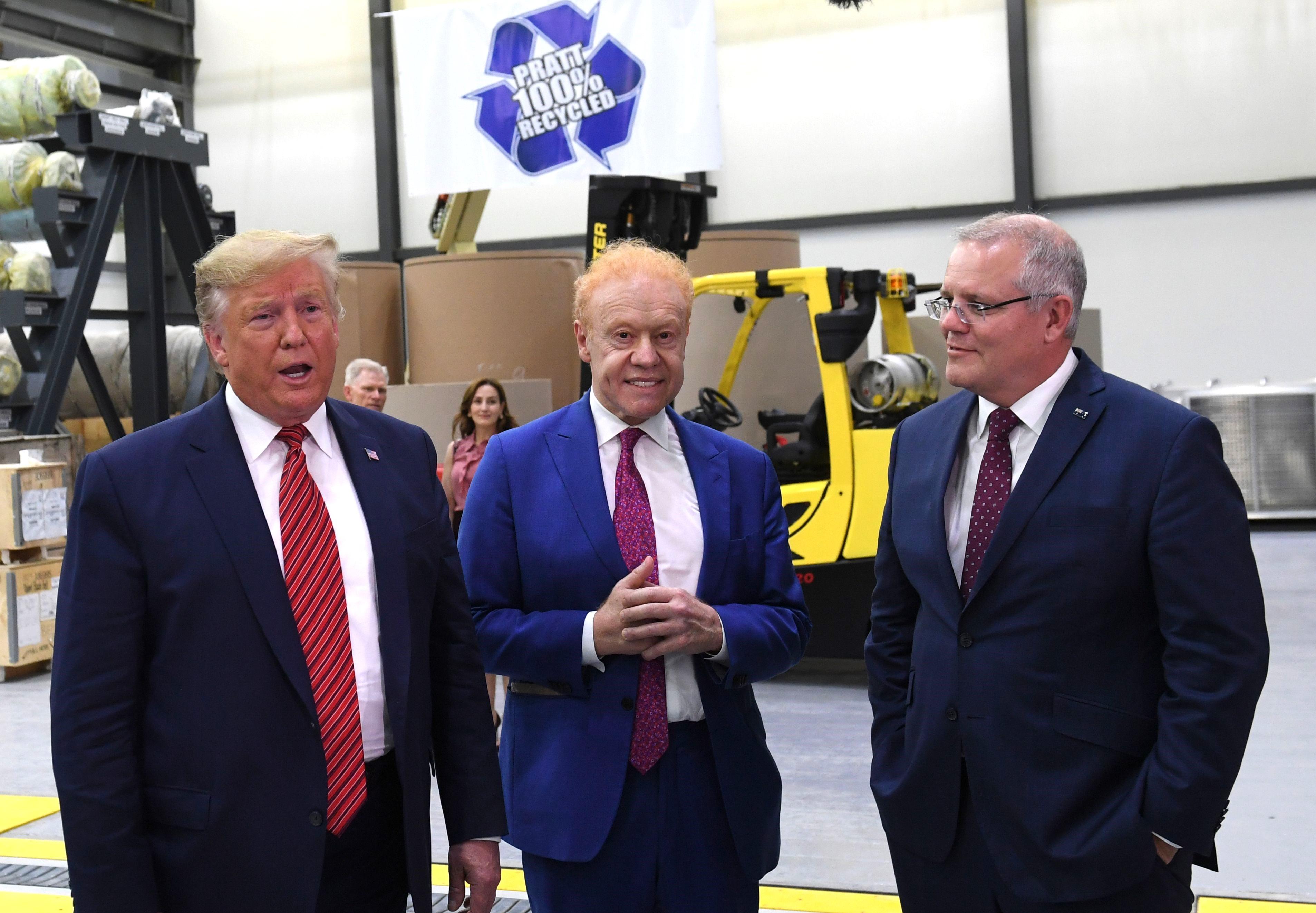 US President Donald Trump (L), Global Chairman of Pratt/Visy Industries Anthony Pratt and former Australian Prime Minister Scott Morrison (R) visit Pratt Industries during the plant's opening in Wapakoneta, Ohio on Sept. 22, 2019. (Saul Loeb/AFP via Getty Images)