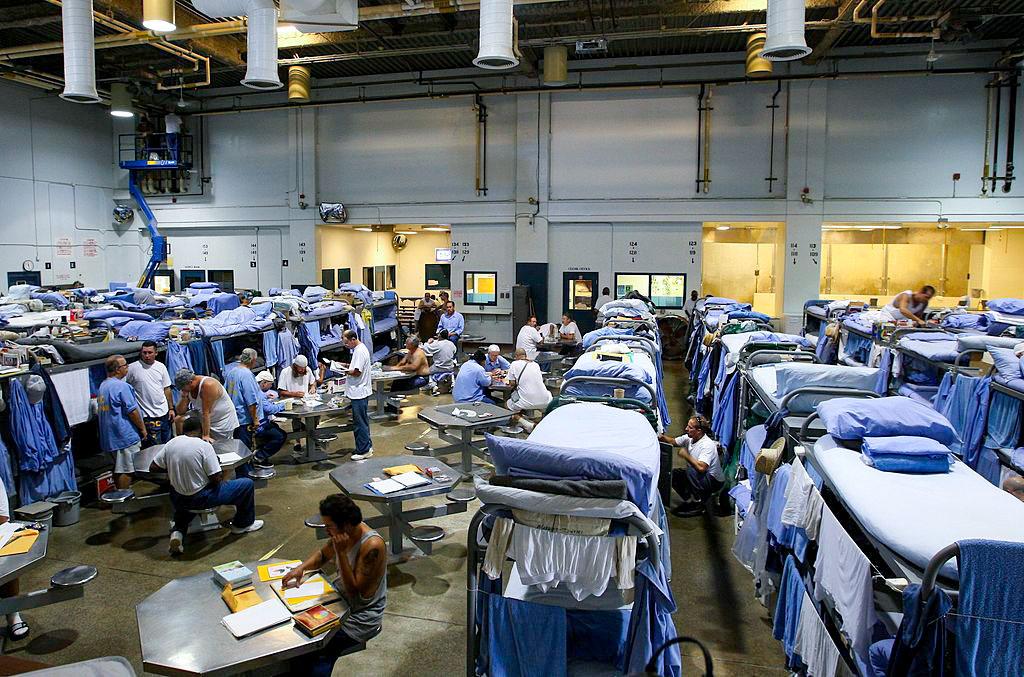 Inmates at the Mule Creek State Prison interact in a gymnasium that was modified to house prisoners, in Ione, Calif., on Aug. 28, 2007, when overcrowding was a problem in the state. California has since reduced its prison population to a 35-year low in 2025 through a combination of policy changes and diversion programs. (Justin Sullivan/Getty Images)