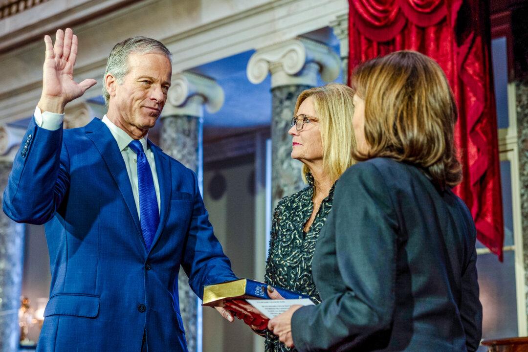 Vice President Kamala Harris swears in Sen. John Thune (R-S.D.), as his wife, Kimberly Thune, looks on, in the old senate chamber for the Ceremonial Swearing in Washington on Jan. 3, 2023. (Tasos Katopodis/Getty Images)