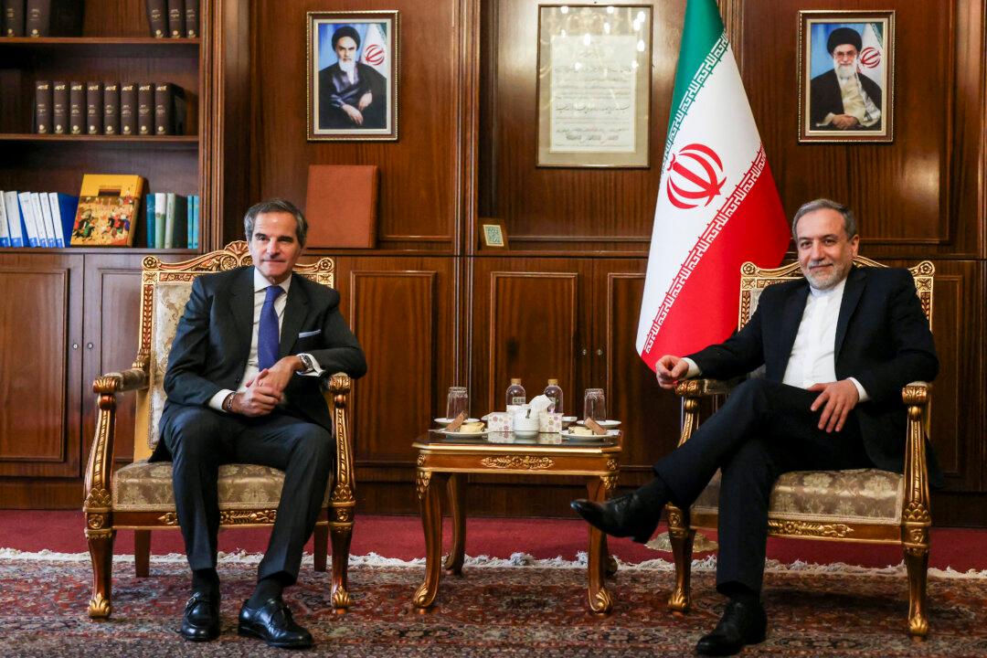 Iran's Foreign Minister Abbas Araghchi (Right) and International Atomic Energy Agency (IAEA) Director General Rafael Mariano Grossi pose for a photo before their meeting in Tehran, Iran, on Nov. 14, 2024. (Atta Kenare/AFP via Getty Images)