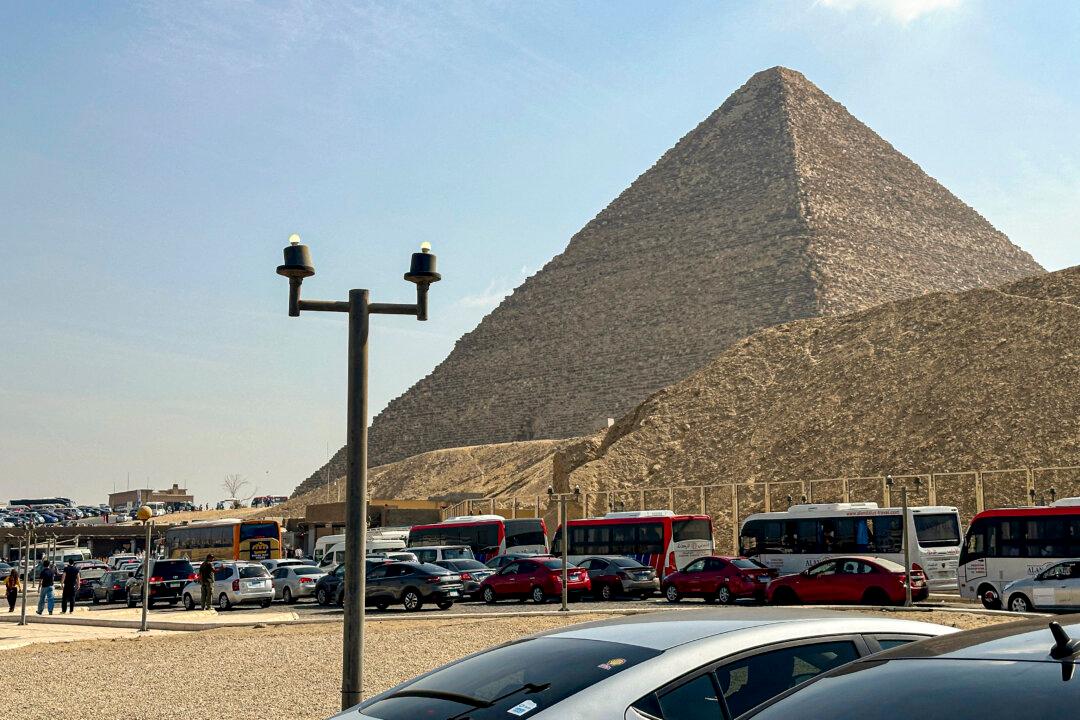 Cars queue at a checkpoint for security inspections at the entrance of the Great Pyramids on the Giza Plateau, just outside the Egyptian capital of Cairo on Nov. 14, 2024. (Khaled Desouki/AFP via Getty Images)