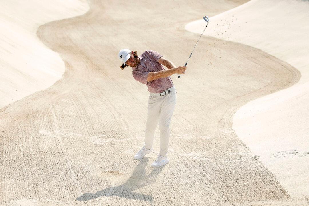 Tommy Fleetwood of England plays a shot from a bunker on the third hole on day one of the DP World Tour Championship 2024 at Jumeirah Golf Estates in Dubai, United Arab Emirates, on Nov. 14, 2024. (Richard Heathcote/Getty Images)