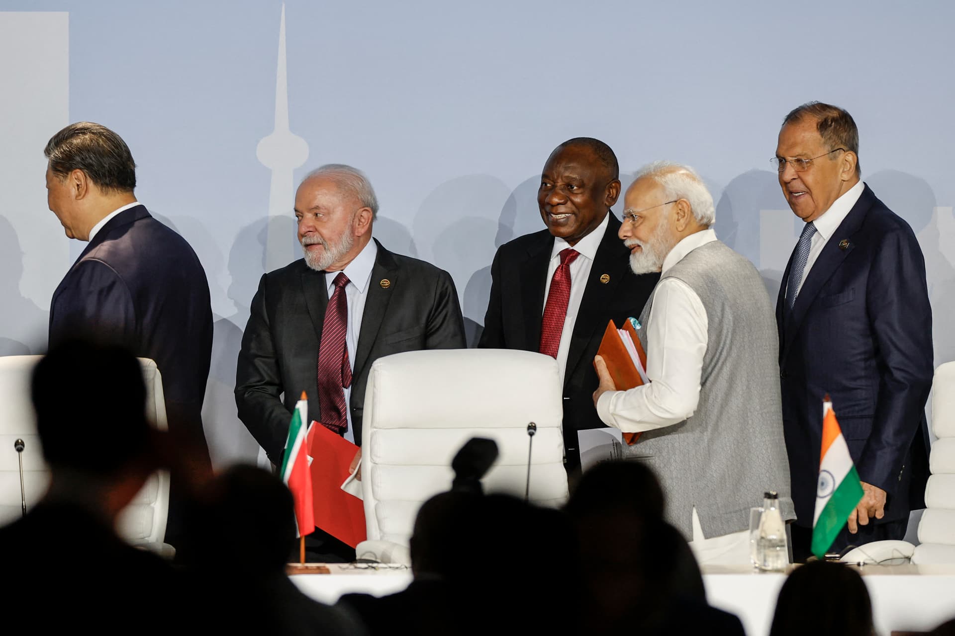 (From L to R) Chinese leader Xi Jinping, Brazilian President Luiz Inácio Lula da Silva, South African President Cyril Ramaphosa, Indian Prime Minister Narendra Modi, and Russian Foreign Minister Sergei Lavrov gesture as they attend the 2023 BRICS Summit at the Sandton Convention Center in Johannesburg on Aug. 24, 2023. (Gianluigi Guercia/AFP via Getty Images)