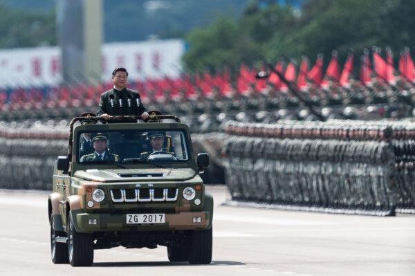 Xi Jinping inspects People's Liberation Army soldiers at a barracks in Hong Kong on June 30, 2017. (Dale de la Rey/AFP via Getty Images)