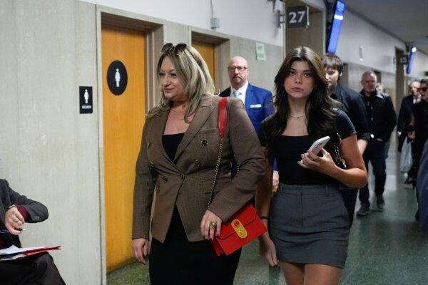 Krista Lee, (L), ex-wife of Cash App founder Bob Lee, left, and daughter Scout Lee walk to Department 28 to enter the courtroom at the Hall of Justice for the murder trial of Nima Momeni, in San Francisco on Dec. 2, 2024. (Godofredo A. Vásquez/AP Photo)