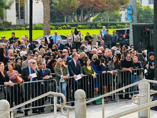 Hundreds crowd the street in front of the Los Angeles Hall of Justice on Dec. 3 to watch new District Attorney Nathan Hochman be sworn in by Arnold Schwarzenegger. (Jill McLaughlin/The Epoch Times)