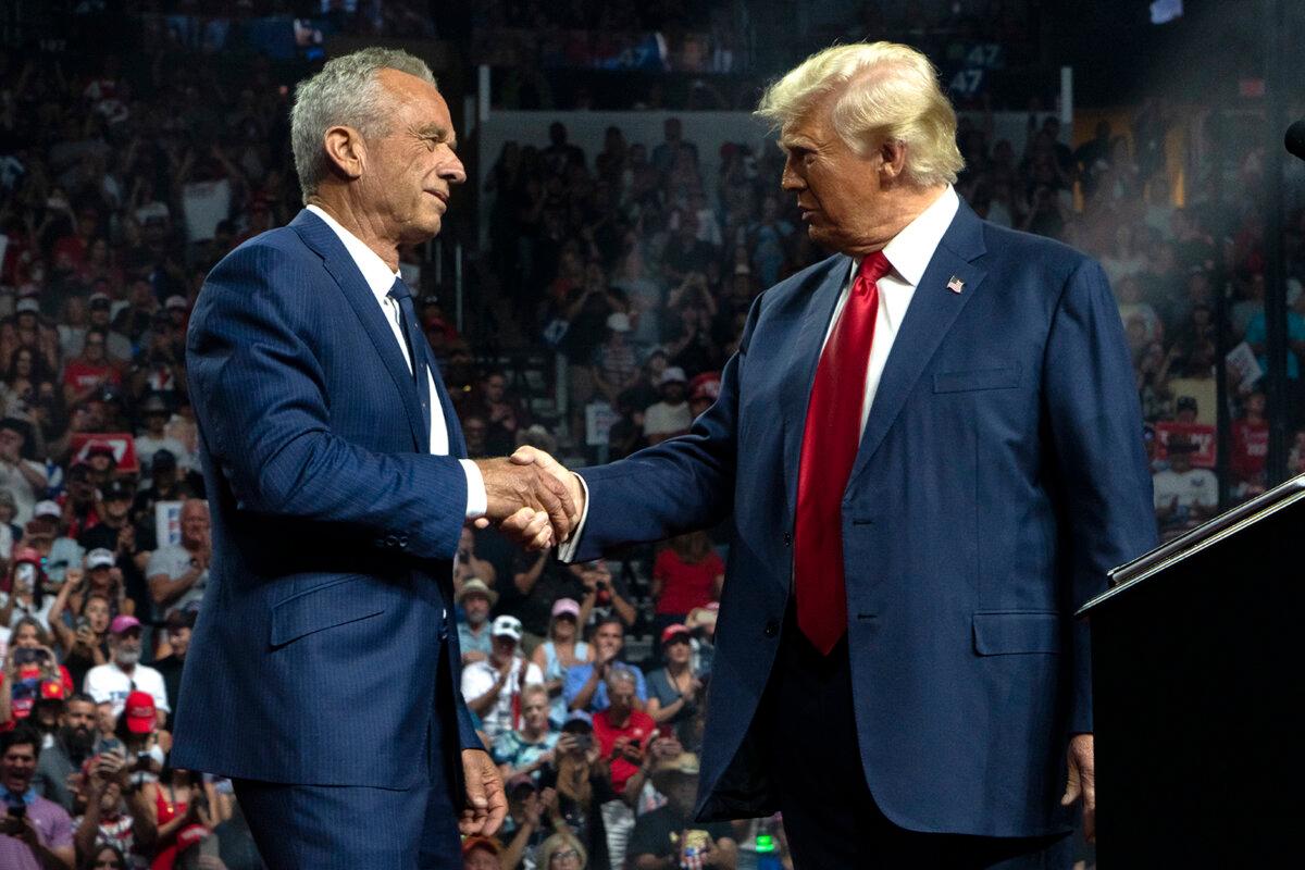 Former presidential candidate Robert F. Kennedy Jr. and Republican presidential nominee, former U.S. President Donald Trump shake hands during a campaign rally at Desert Diamond Arena in Glendale, Ariz., on Aug. 23, 2024. (Rebecca Noble/Getty Images)