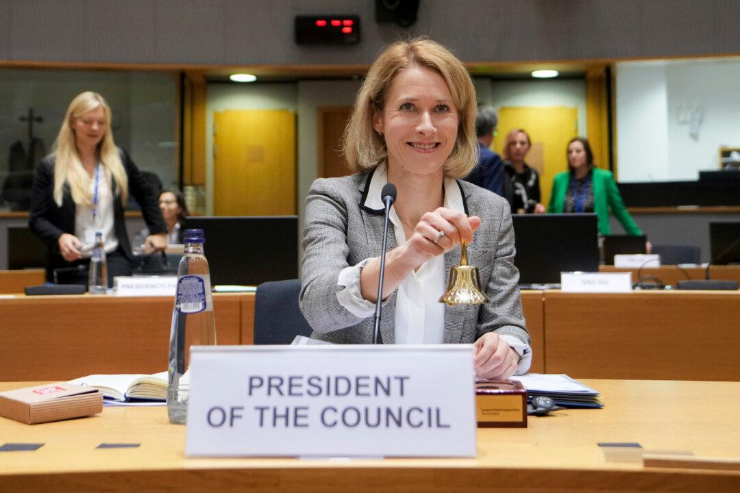 European Union foreign policy chief Kaja Kallas rings a bell to signify the start of a meeting of EU foreign ministers at the European Council building in Brussels on Dec. 16, 2024. The EU is to suspend visas for Georgian officials over the security crackdown on opposition protestors. (Virginia Mayo/AP Photo)