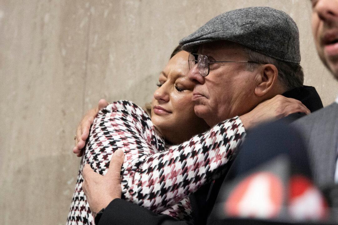 Bob Lee's ex-wife Krista Lee is embraced by Rick Lee, Bob Lee's father, at the Hall of Justice following Nima Momeni's murder trial in San Francisco Calif., on Dec. 17, 2024. (Benjamin Fanjoy/AP Photo)