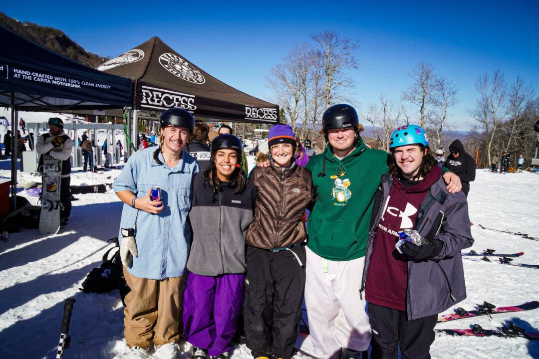 Coby Liebelt, Bella Horrock, and their teammates on the Liberty University freestyle ski team participate in a competition at Beech Mountain Resort in Beech Mountain, N.C., on Dec. 7, 2024. (T.J. Muscaro/The Epoch Times)