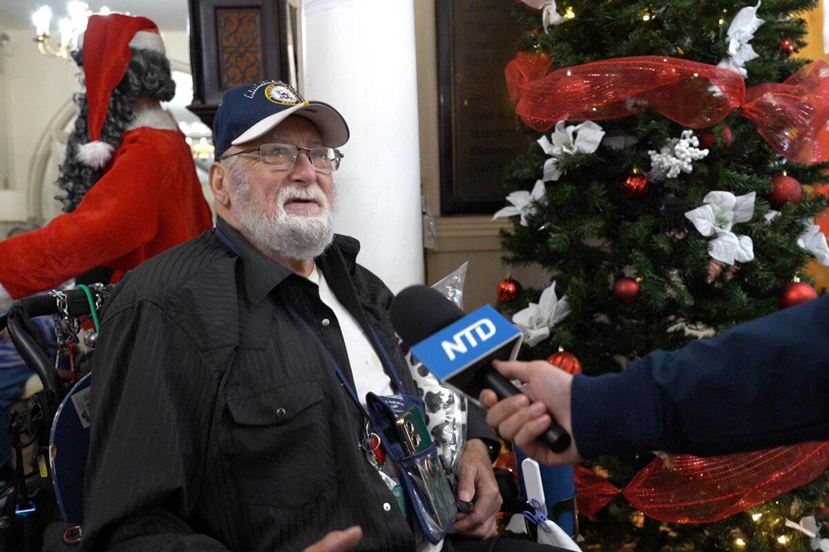 Edward Kipp, a Navy veteran, was so excited to receive a free blanket, in Philadelphia on Dec. 18, 2024. (William Huang/The Epoch Times)