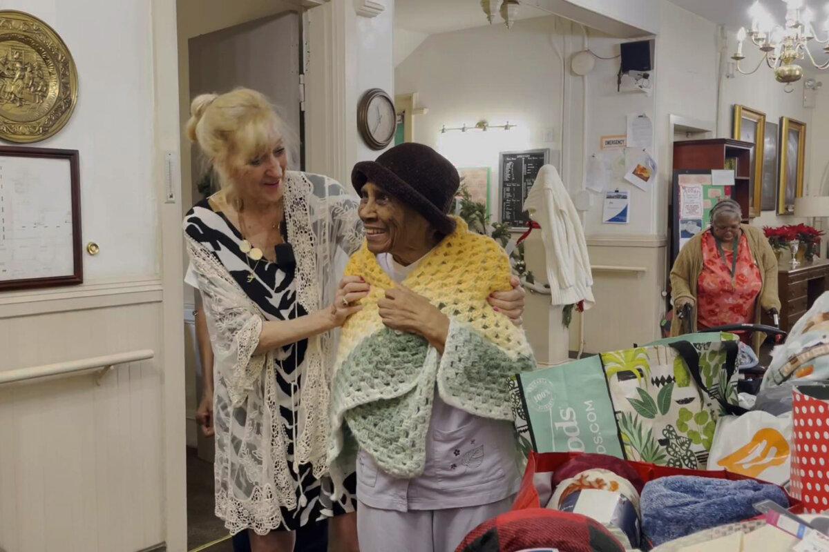 The “Happy Flower Lady” Patricia Gallagher has brought warmth and comfort to thousands through her unique project of delivering blankets to seniors in Philadelphia on Dec. 18, 2024. (William Huang/The Epoch Times)