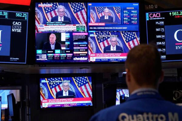 Comments by Federal Reserve Chair Jerome Powell appear on screens on the floor of the New York Stock Exchange in New York City on Nov. 7, 2024. (Richard Drew/AP Photo)