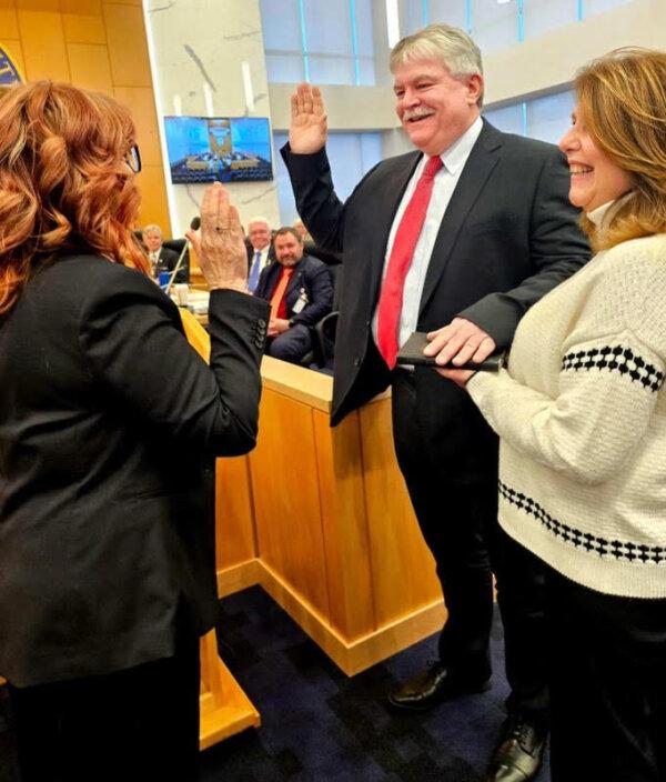 Kevin Hines (C) is sworn in as the Orange County Legislature chairman by Orange County Clerk Kelly Eskew (L) in Goshen, N.Y., on Jan. 2, 2025. (Courtesy of Kevin Hines)