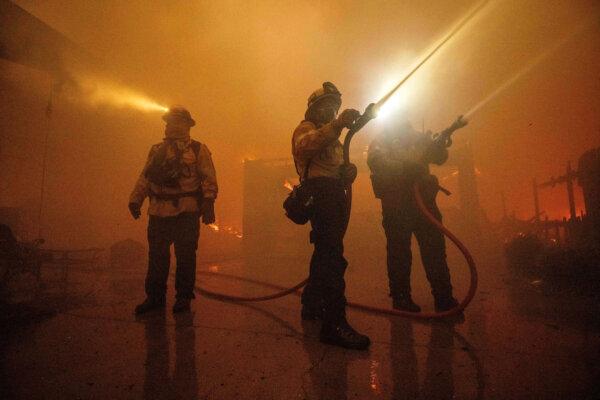 Fire crews battle the Eaton Fire in Altadena, Calif., on Jan. 8, 2025. (Ethan Swope/AP Photo)