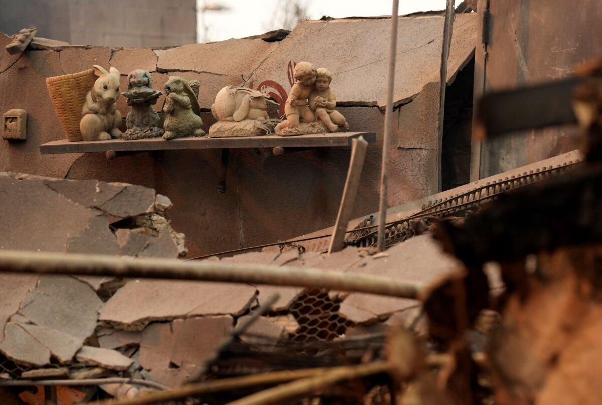 Charred bunny sculptures sit on a shelf amid debris inside the destroyed Bunny Museum, in Altadena, Calif., on Jan. 9, 2025. (Chris Pizzello/AP Photo)