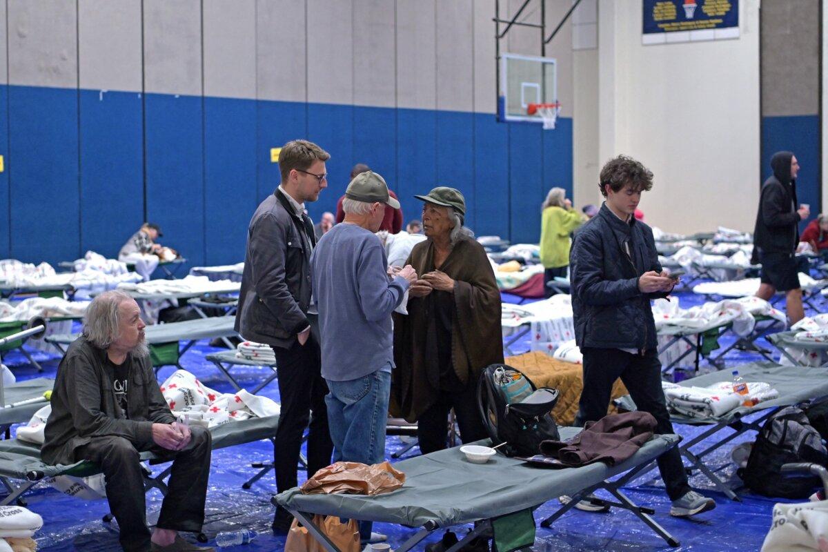 Evacuees from the Palisades fire at an evacuation and shelter center at Westwood Recreation Center in Los Angeles on Jan. 8, 2025. (Agustin Paullier/AFP via Getty Images)