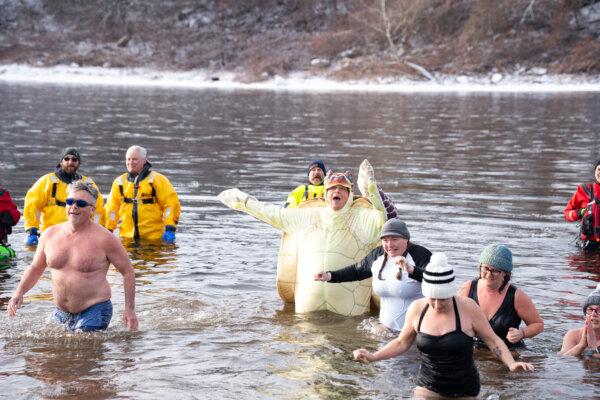 Chip Estenes cheered in the Delaware River by the West End Beach in Port Jervis, N.Y., on Jan. 11, 2025. (Larry Dye/The Epoch Times)