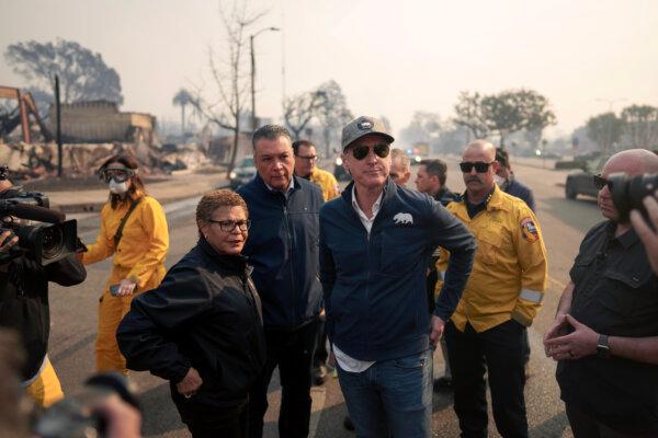 California Gov. Gavin Newsom and Los Angeles Mayor Karen Bass tour the downtown business district of Pacific Palisades as the fire continues to burn on Jan. 8. (Eric Thayer/Getty Images)