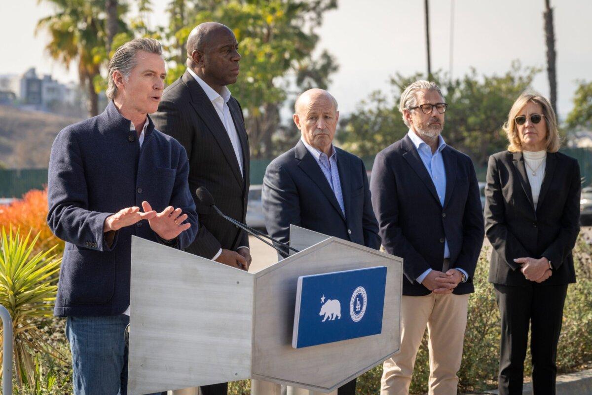 California Gov. Gavin Newsom (L) speaks at a news conference at Dodger Stadium to announce the creation of LA Rises, Jan. 28, 2024. With him, from left, are Magic Johnson, Dodgers President Stan Kasten, and 2028 Summer Olympics organizer Casey Wasserman. (Governor Gavin Newsom's Office)