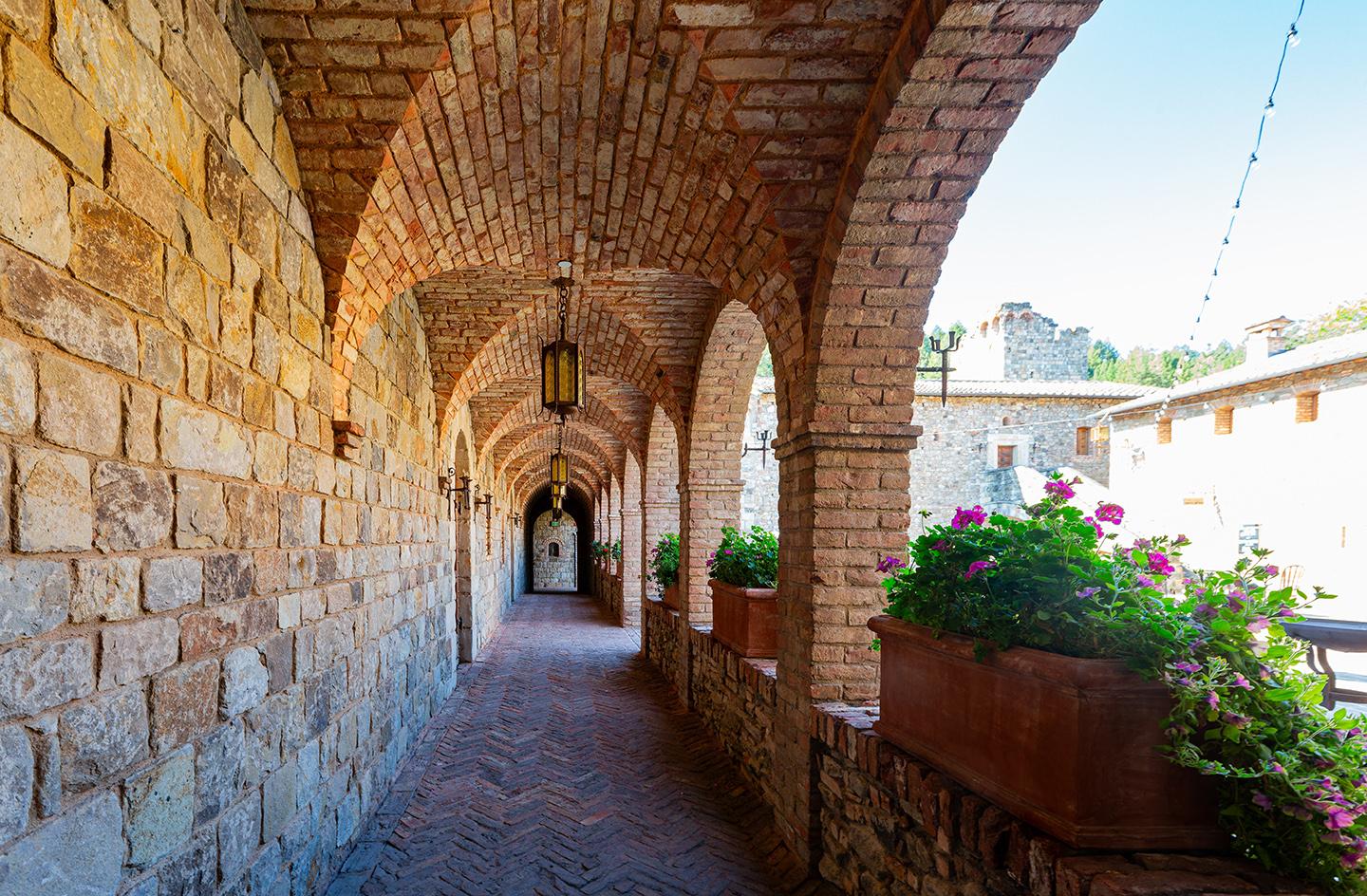 Covered walkways at monasteries, cathedrals, and some colleges are called cloisters, which sport a medieval loggia design. The covered walkway has at least one side that's typically open to a garden and the other side is the wall of a main structure. Castello di Amorosa’s brick and stone cloisters embrace the Gothic-style pointed arch design in the loggias’ ceilings, while the arches facing outward are more classically Roman in design and appear to sit above square brick columns. (Kit Leong/Shutterstock)