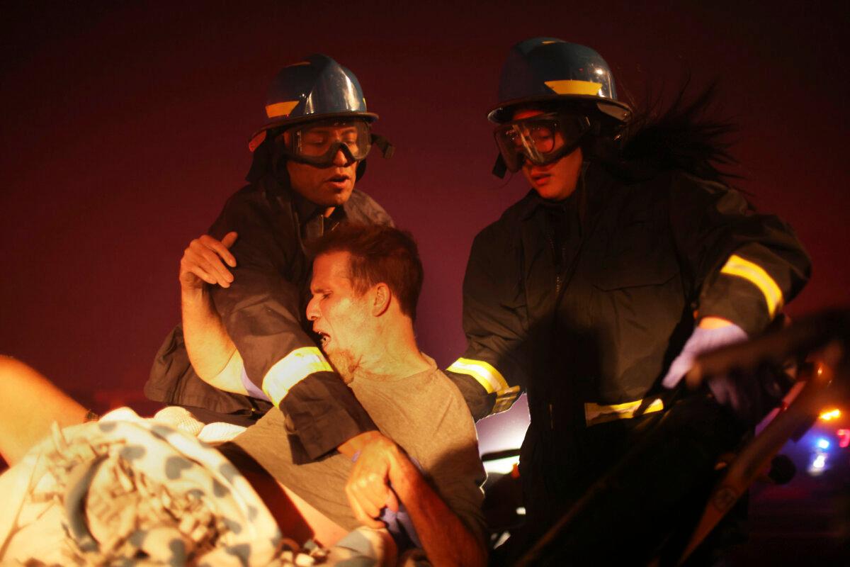 A resident of a senior center is evacuated as the Eaton Fire approaches in Altadena, Calif., on Jan. 7, 2025. (Ethan Swope/AP Photo)