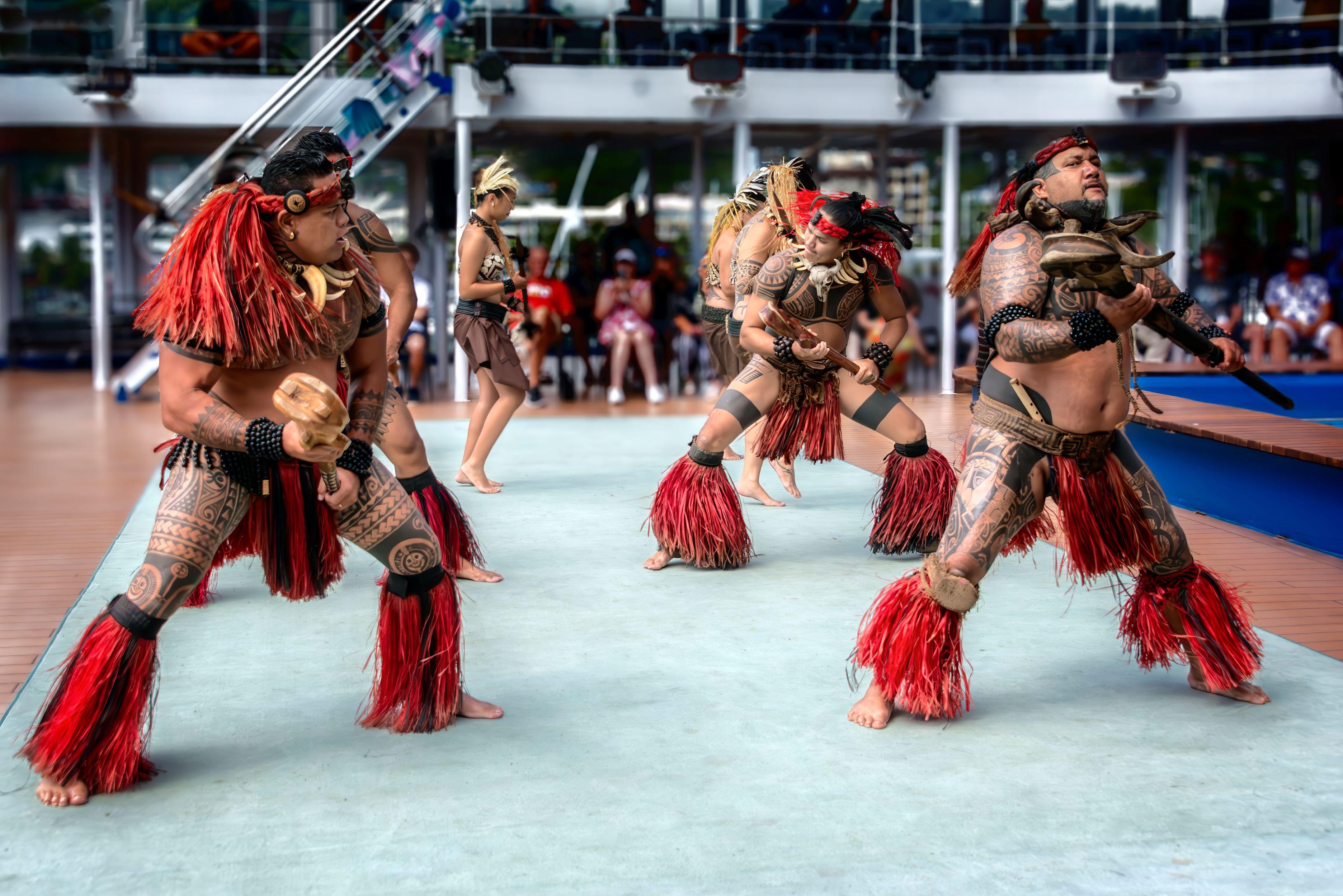 Marquesan Toa Huhina dancers perform on the Aranui 5 pool deck in Papeete harbor. Their tattoos are a form of cultural expression and personal identity. (Maria Coulson)