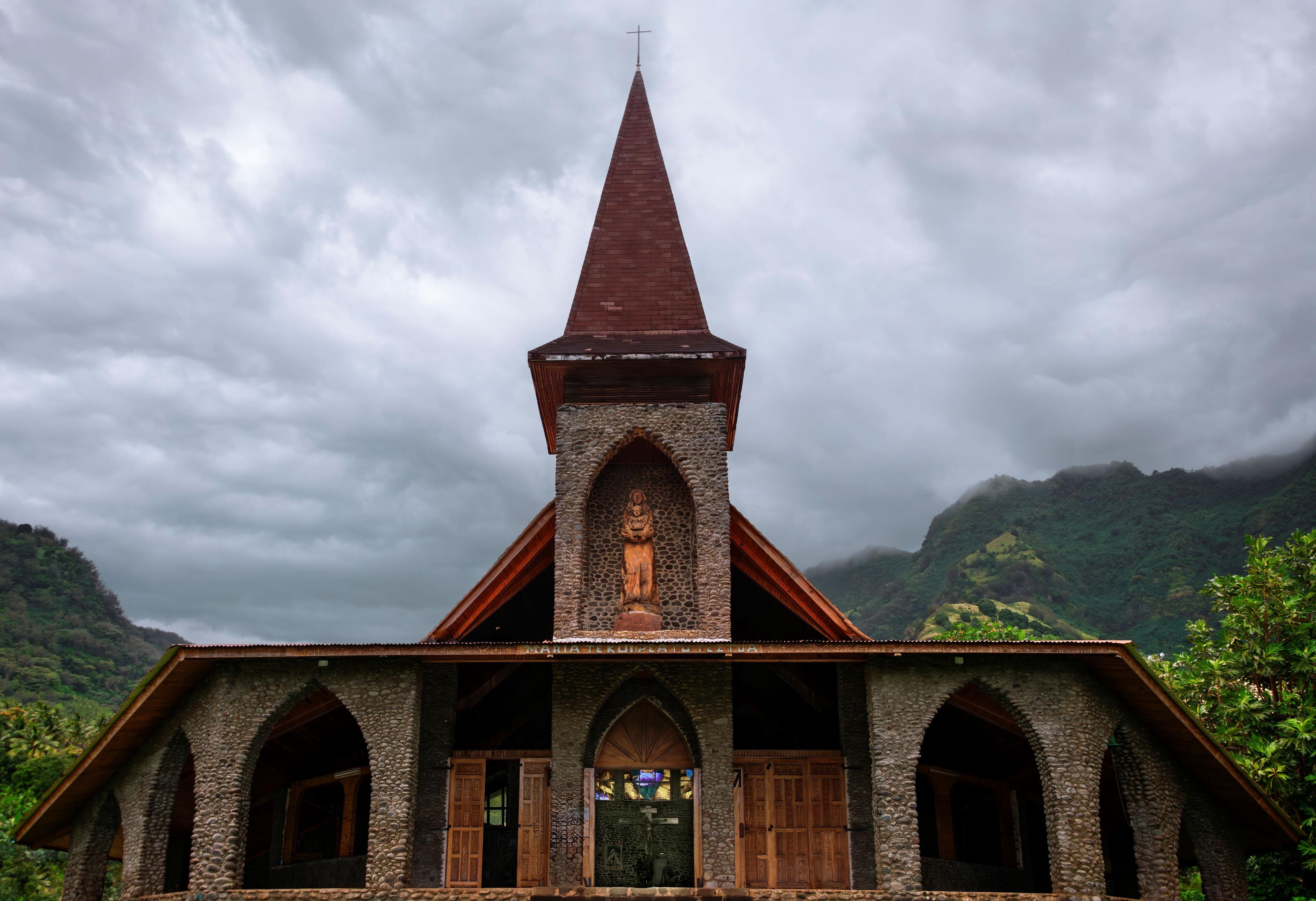 At the Catholic church in Vaitahu, Tahuata, a wood statue of the Virgin Mary holds baby Jesus, who cradles breadfruit. (Maria Coulson)