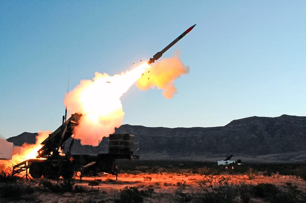 (Left) The U.S. military test fires an unarmed intercontinental ballistic missile at Vandenberg Air Force Base, Calif., on May 3, 2017. (Right) The U.S. Army test fires a Patriot missile, a mobile missile defense interceptor deployed by the United States. (Ringo Chiu/AFP via Getty Images, U.S. Army)