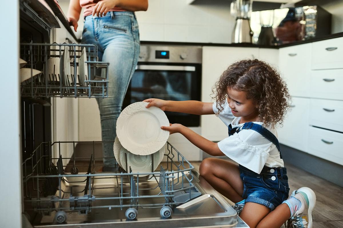 Helping out with chores not only helps children develop life skills, they also foster in them trust and confidence. (PeopleImages.com - Yuri A/Shutterstock)