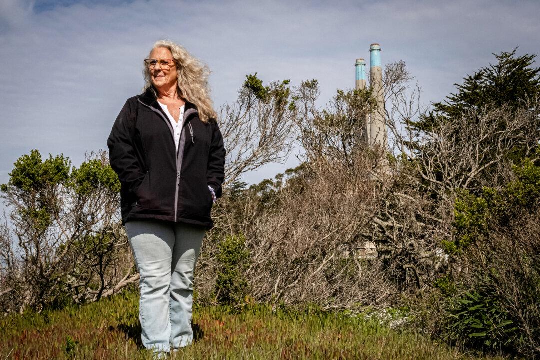 Tonya Rivera stands near the Moss Landing Power Plant in Moss Landing, Calif., on Feb. 17, 2025. (John Fredricks/The Epoch Times)