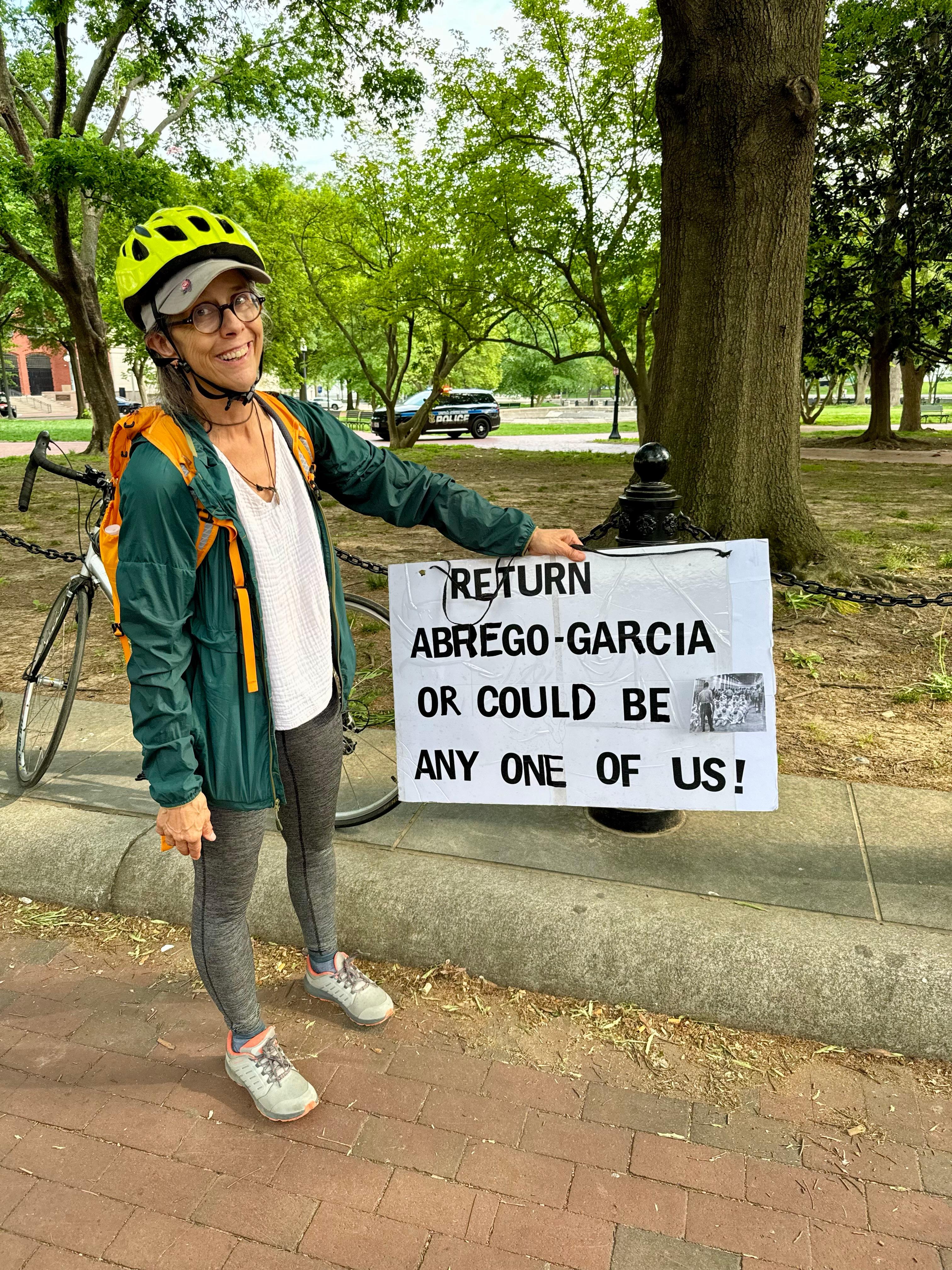Rebecca Henry, a retiree from Silver Spring, Md., holds up a sign demanding Kilmar Abrego Garcia's return in Lafayette Park in Washington on May 1, 2025. (Arjun Singh/The Epoch Times)