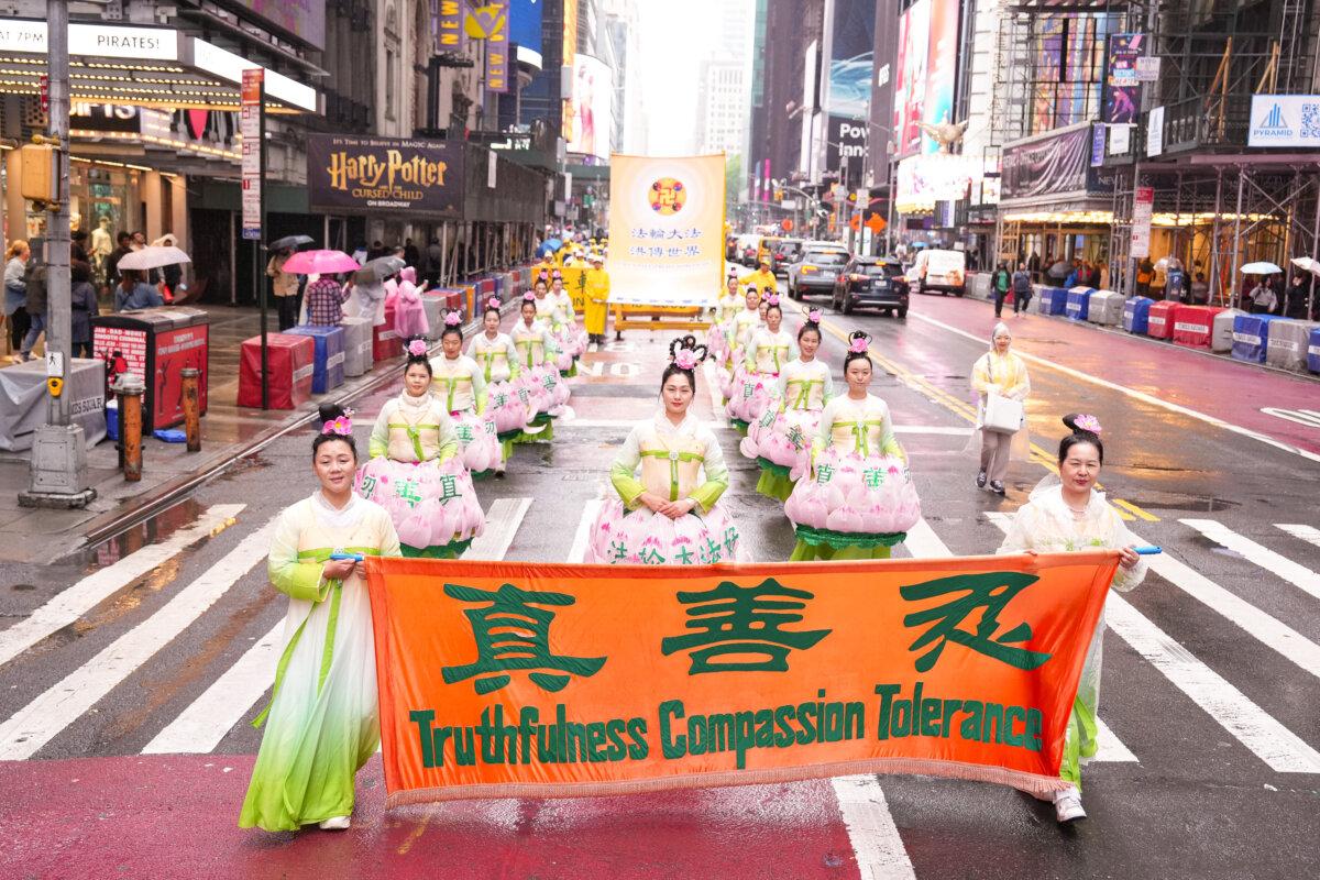 Falun Gong practitioners take part in a parade to celebrate World Falun Dafa Day and call for an end to the Chinese Communist Party's persecution of the faith in China, in New York City on May 9, 2025. (Larry Dye/The Epoch Times)
