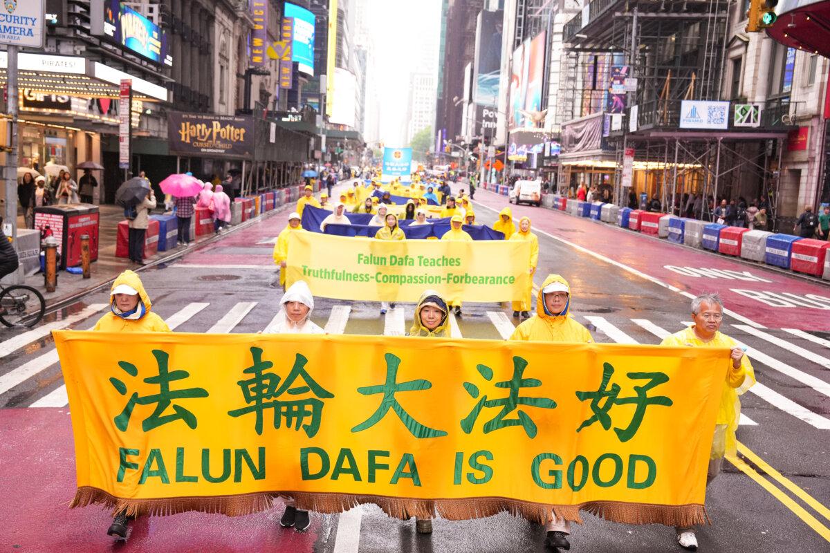 Falun Gong practitioners take part in a parade to celebrate World Falun Dafa Day in New York City on May 9, 2025. (Larry Dye/The Epoch Times)