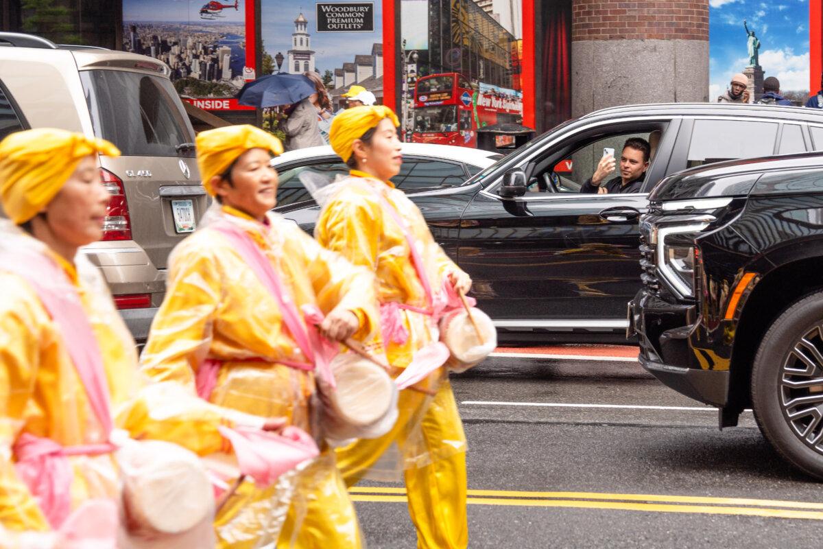 Falun Gong practitioners take part in a parade to celebrate World Falun Dafa Day and call for an end of the persecution in China, in New York City, on May 9, 2025. (Samira Bouaou/The Epoch Times)