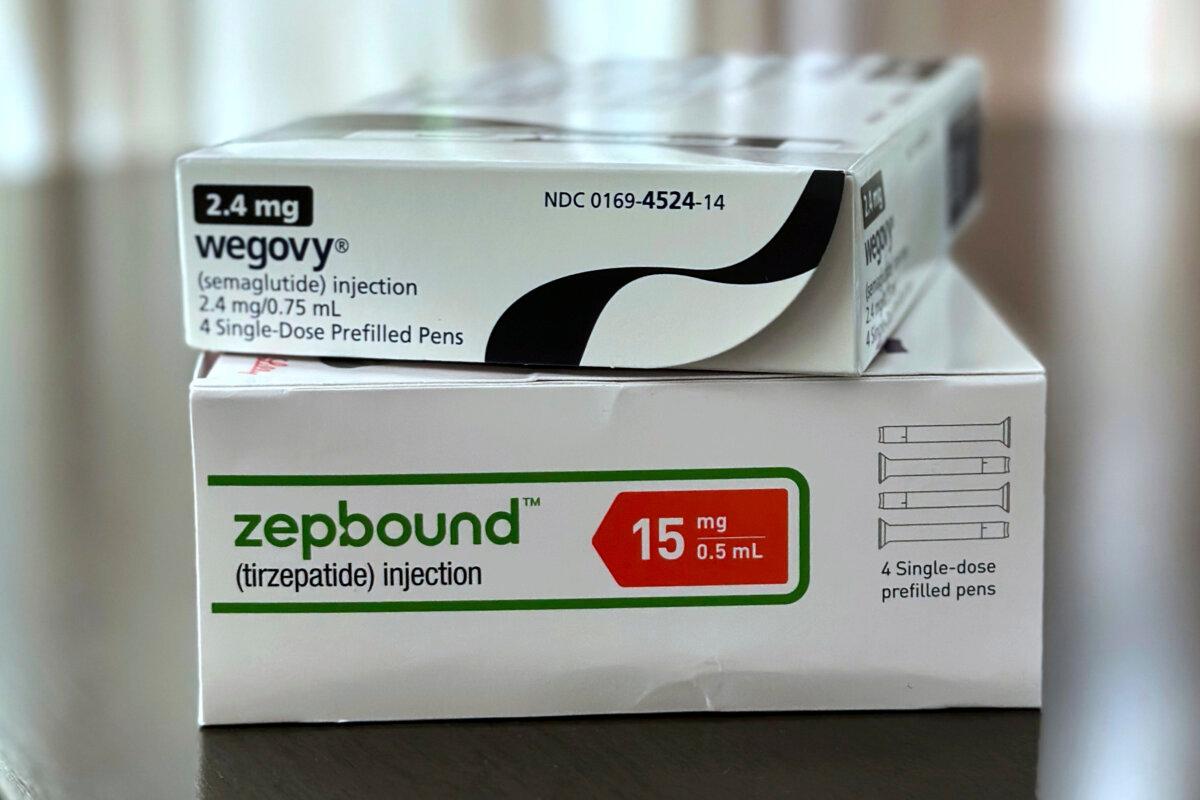 Boxes for the medications Wegovy and Zepbound are arranged for a photograph in California on May 8, 2025. (JoNel Aleccia/AP Photo)
