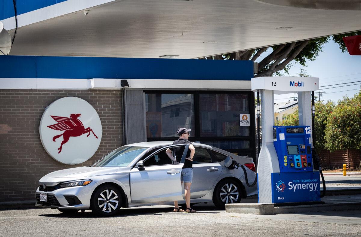 A woman fills her car up with gasoline in Los Angeles on July 1, 2025. (John Fredricks/The Epoch Times)