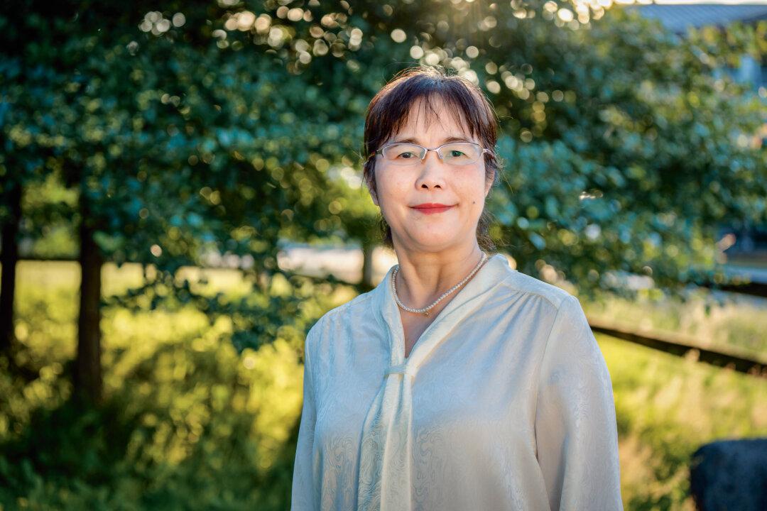 He Zhiwei in Vancouver, Canada, on July 14, 2025. She was forced to flee her home during the persecution and couldn't see her daughter for 12 years. (The Epoch Times)