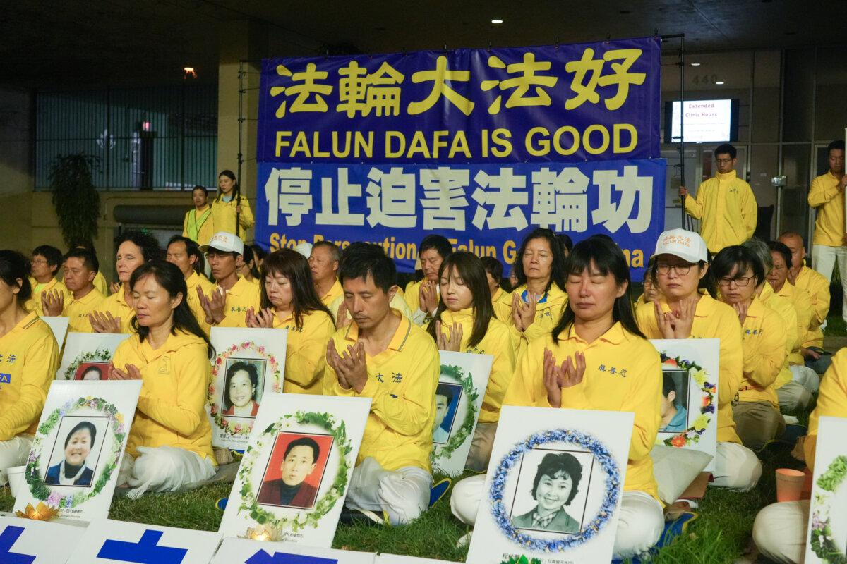 Falun Gong practitioners hold a candlelight memorial rally in front of the Chinese Consulate in Los Angeles on July 19, 2025, calling for the end of the persecution of Falun Gong in China. (Alex Lee/The Epoch Times)