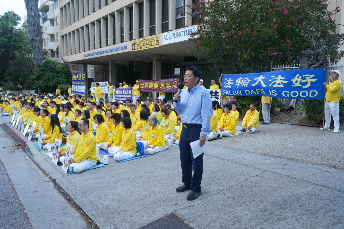 Wu Yingnian, spokesperson for the Los Angeles Falun Dafa Association and professor at the University of California, Los Angeles (UCLA), speaks at a candlelight vigil for Falun Gong practitioners in Los Angeles on July 19, 2025. (Alex Lee/The Epoch Times)