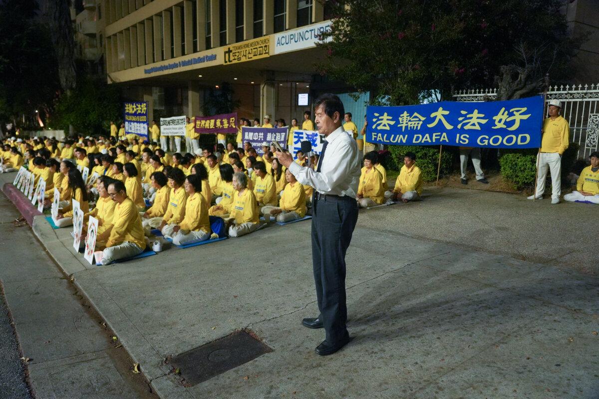 Li Youfu, president of the Southwest Falun Dafa Association, speaks at a candlelight vigil for Falun Gong practitioners in Los Angeles on July 19, 2025. (Alex Lee/The Epoch Times)