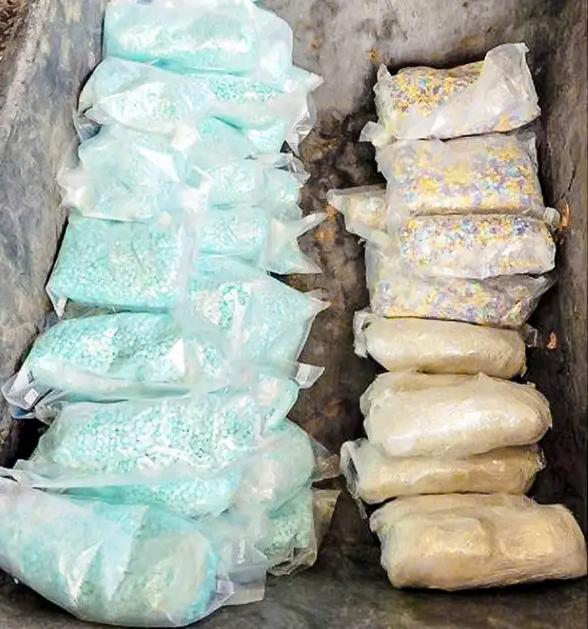 (Left) Police seize a new variety of fentanyl during a recent drug bust that had been molded into the shape of a gummy bear in Lethbridge, Canada. (Middle and Right) Customs and Border Protection seizes approximately 47,000 rainbow-colored fentanyl pills, 186,000 blue fentanyl pills, and 6.5 pounds of methamphetamine hidden in the floor compartment of a vehicle at the port of entry on the U.S.–Mexico border in Nogales, Ariz., on Sept. 3, 2022. (Lethbridge Police Service, U.S. Customs and Border Protection)