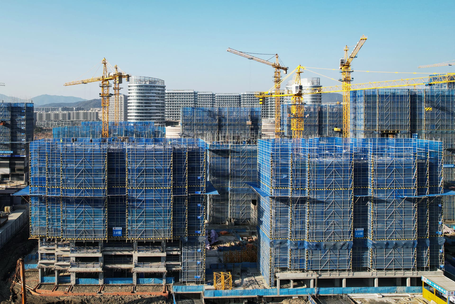 The aerial view shows residential buildings under construction by China's indebted real estate developer Vanke in Hangzhou, Zhejiang Province, China, on March 15, 2024. (STR/AFP via Getty Images)