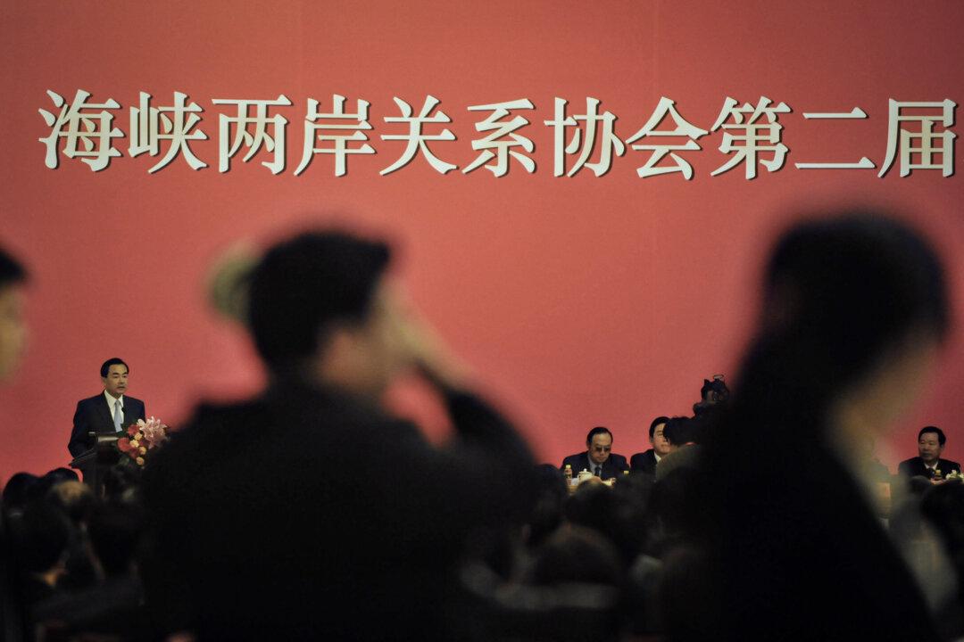Wang Yi (L), head of China's Taiwan Affairs Office of the State Council, speaks during the second session of the cross-strait relationship governing council at the Great Hall of the People in Beijing on June 3, 2008. (Frederic J. Brown/AFP via Getty Images)