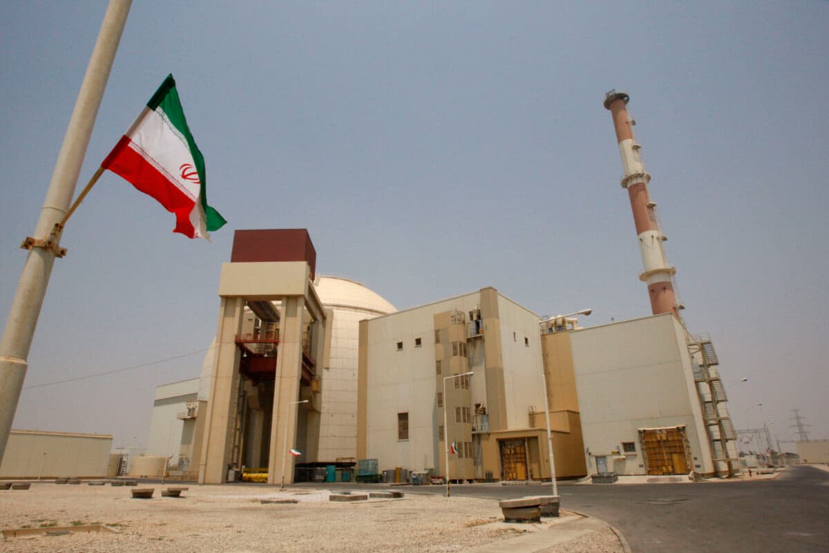 An Iranian flag flutters in front of the reactor building of the Bushehr Nuclear Power Plant, just outside the southern city of Bushehr, Iran, on Aug. 21, 2010. (Vahid Salemi/AP Photo)
