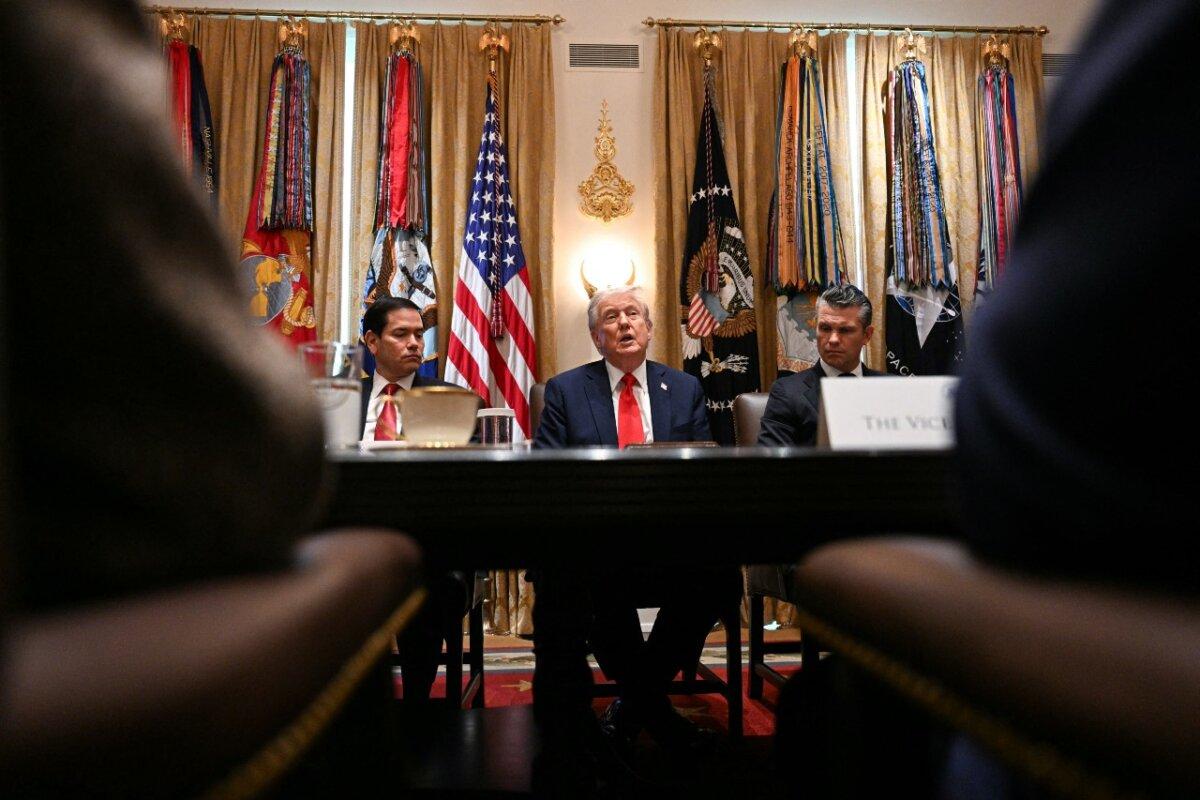 President Donald Trump (C) speaks, alongside Secretary of State Marco Rubio (L) and Secretary of Defense Pete Hegseth (R), during a cabinet meeting in the Cabinet Room of the White House on Oct. 9, 2025. (Jim Watson/AFP via Getty Images)